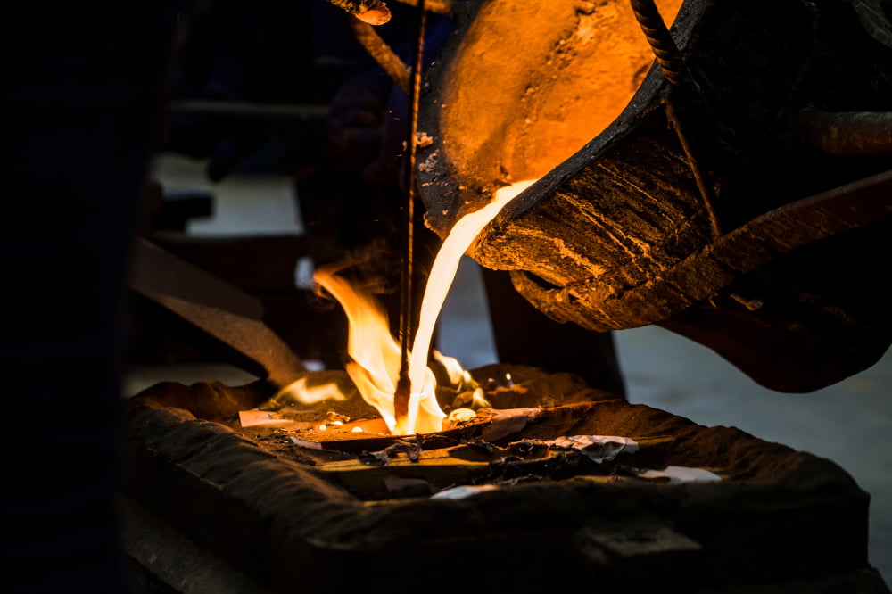 Image of hot metal being cast into a mould